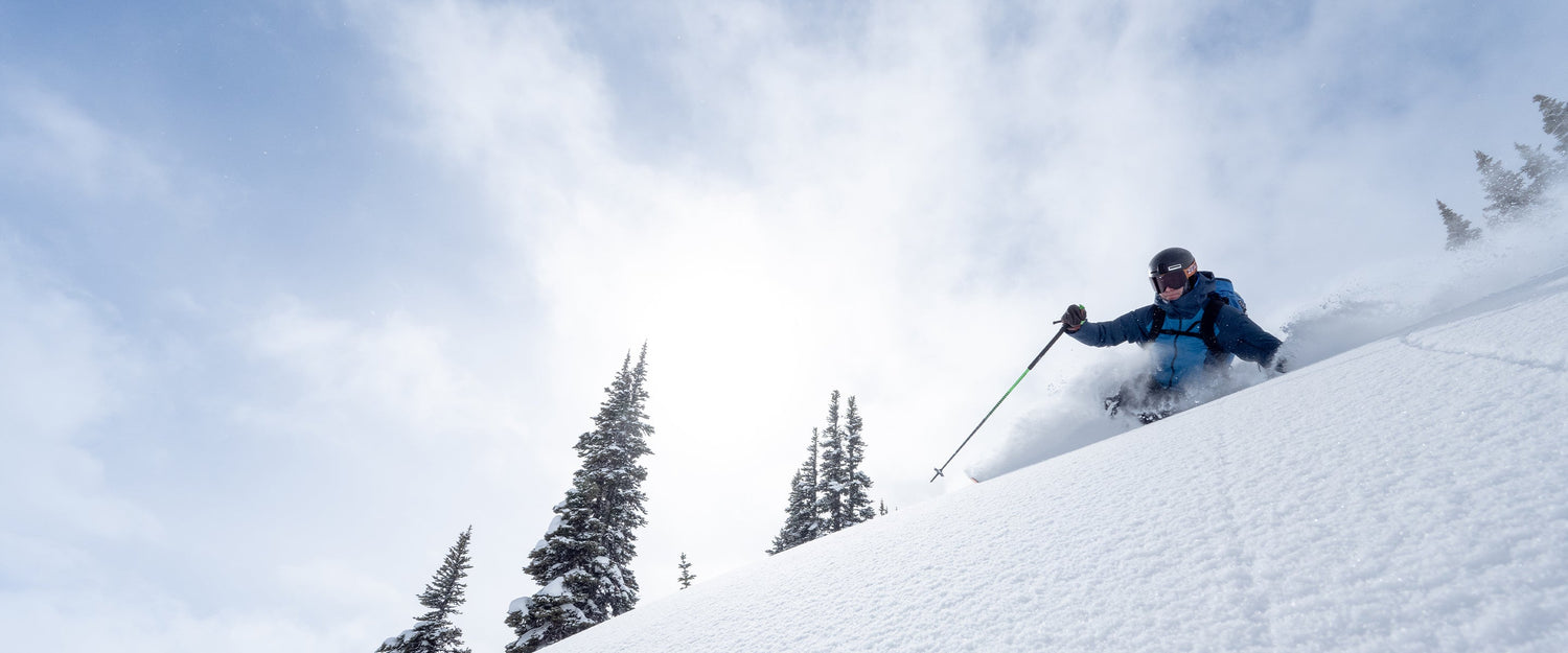 BD athlete Mike Barney skiing on a bluebird day